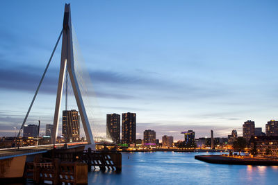 View of suspension bridge with city in background