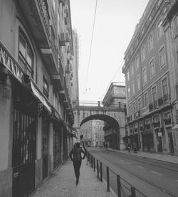 Man walking on street in city