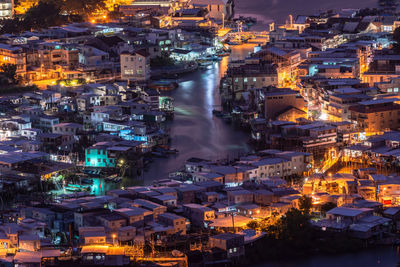 High angle view of illuminated cityscape at night