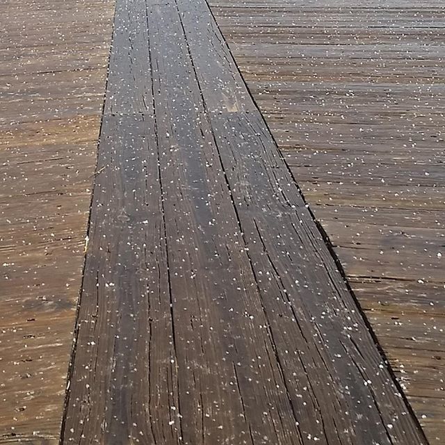 full frame, backgrounds, wet, textured, pattern, water, high angle view, close-up, outdoors, wood - material, no people, street, day, the way forward, rain, reflection, nature, diminishing perspective, transportation, wood