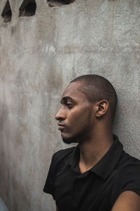 Young man against wall