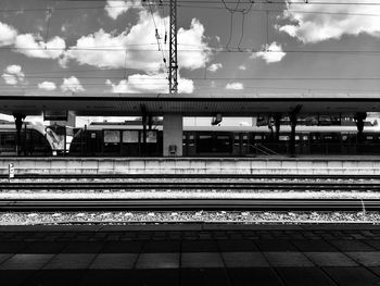 Train at railroad station against sky