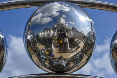 Low angle view of glass against sky