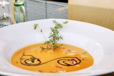 Close-up of tomato soup in bowl on table