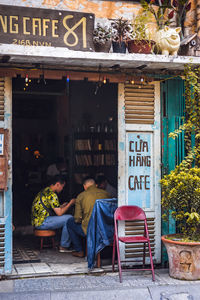 People sitting outside building