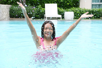 Portrait of smiling girl in swimming pool