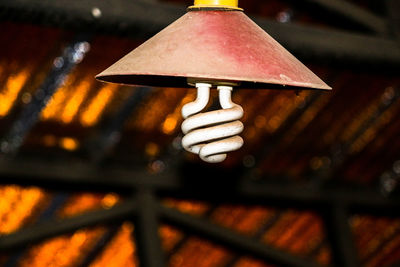 Close-up of illuminated electric lamp on roof