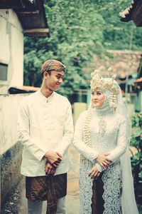 Young couple standing outdoors