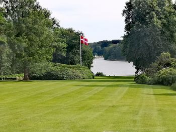 Scenic view of golf course against sky