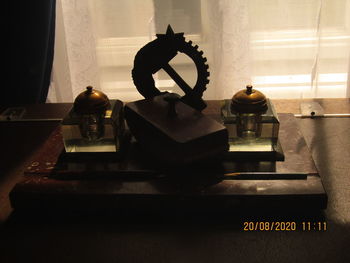 High angle view of statue on table