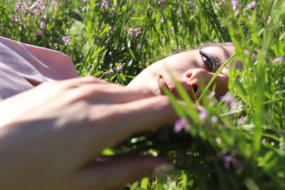 Low section of woman lying on grass