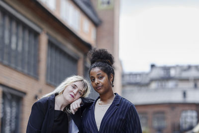 Female friends looking at camera