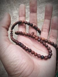 Close-up of hand holding ring