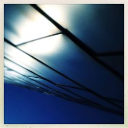 Low angle view of cables against clear sky