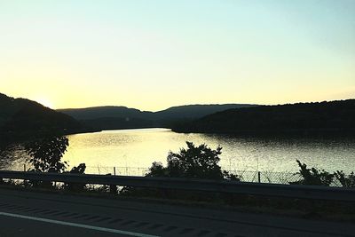 Scenic view of calm lake against clear sky