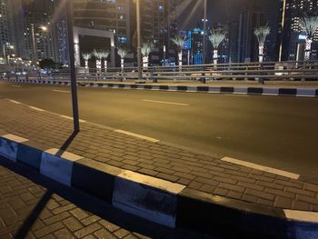 Empty road in city at night