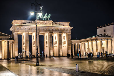 Group of people in front of historical building