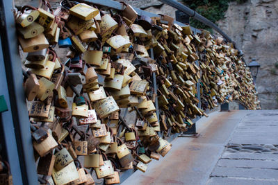 Padlocks hanging on railing