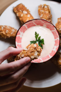 Close-up of hand holding food
