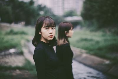 Portrait of woman standing outdoors