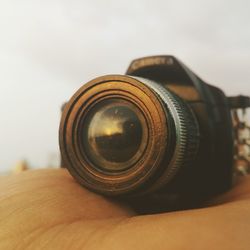 Close-up of hand holding camera