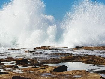 Waves splashing on rocks