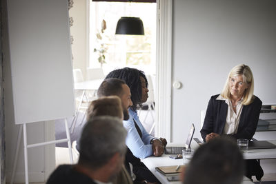 Smiling businesswoman at meeting