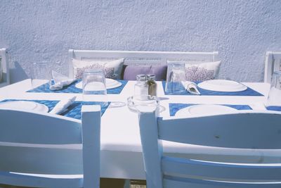 Close-up of chairs on table