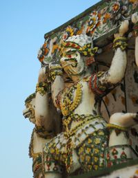 Low angle view of statue against sky