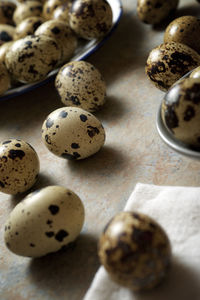 Quail eggs on a stone table.