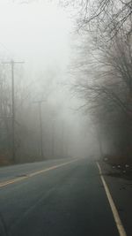 Empty road in foggy weather