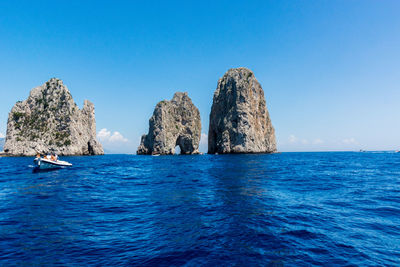 Panoramic view of sea against clear blue sky