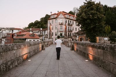 Rear view of man walking on street