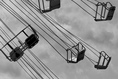 Low angle view of electricity pylon against sky