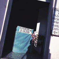 Close-up of man against window