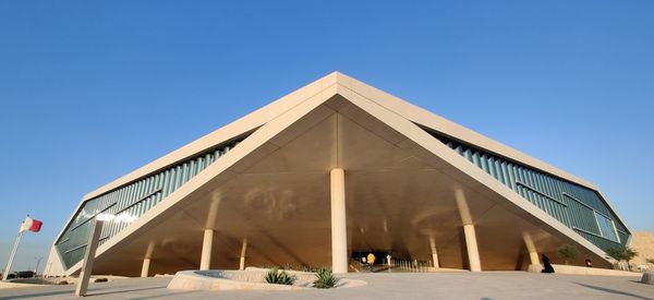 Low angle view of building against blue sky
