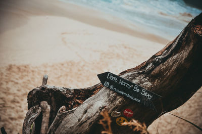 Close-up of text on sand at beach