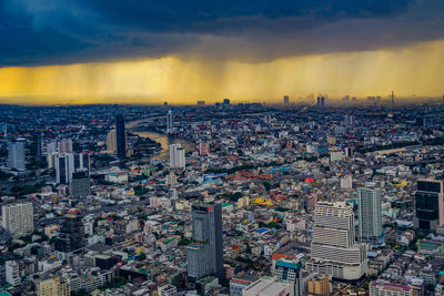 High angle view of city at sunset