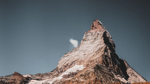 Low angle view of rock formations against clear sky