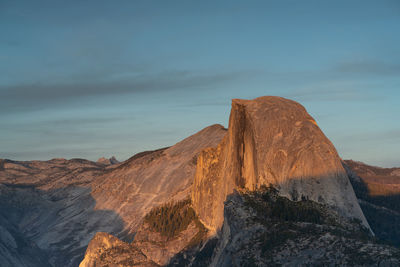 Rock formations on mountain against sky