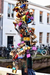 Close-up of padlocks hanging on railing