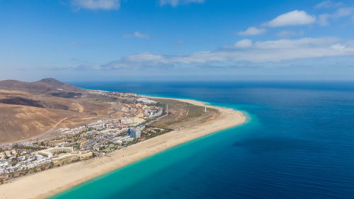 Aerial view of sea and landscape against sky