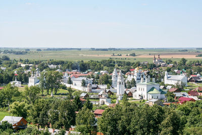 High angle view of cathedral amidst trees against sky