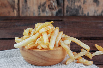 Close-up of french fries on table