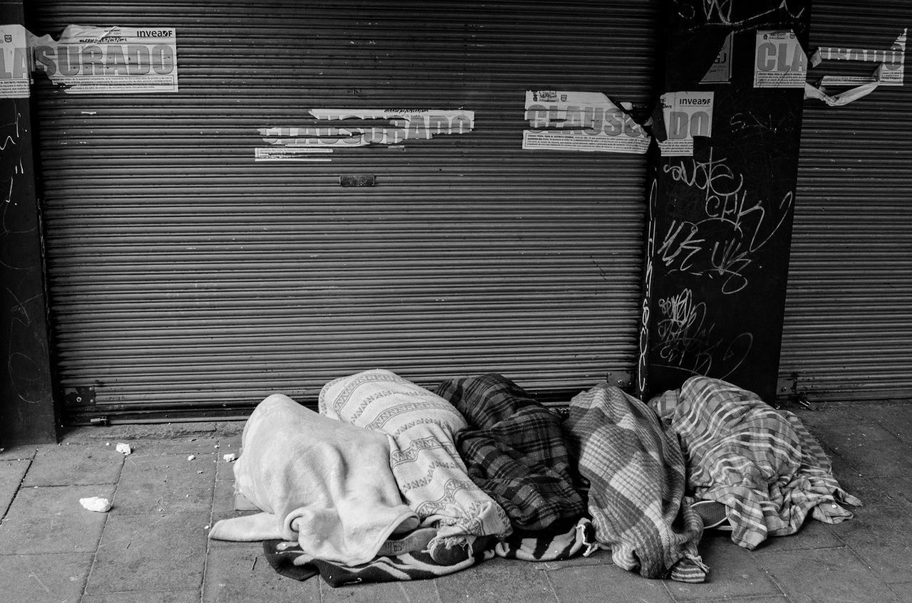 VIEW OF SLEEPING OUTSIDE BUILDING