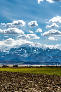 Scenic view of snowcapped mountains against sky