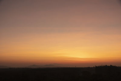 Scenic view of silhouette landscape against sky during sunset