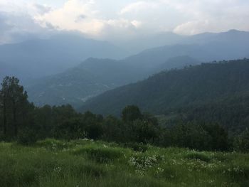 Scenic view of landscape and mountains against sky