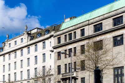 Low angle view of buildings against sky in city