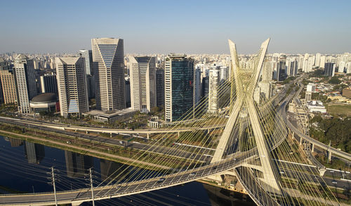 High angle view of modern buildings in city against sky